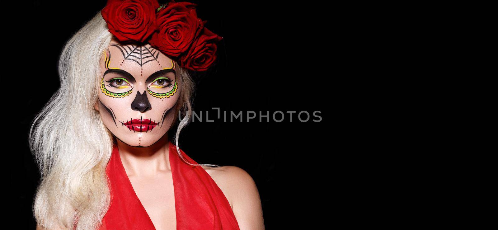 Beautiful Halloween Make-Up Style. Blond Model Wear Sugar Skull Makeup with Red Roses. Santa Muerte concept by MarinaFrost