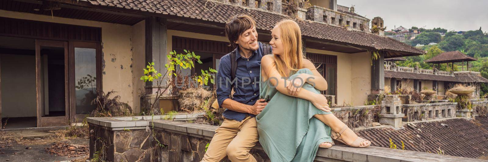 Happy couple in love in abandoned and mysterious hotel in Bedugul. Indonesia, Bali Island. Honeymoon in Bali. BANNER, LONG FORMAT
