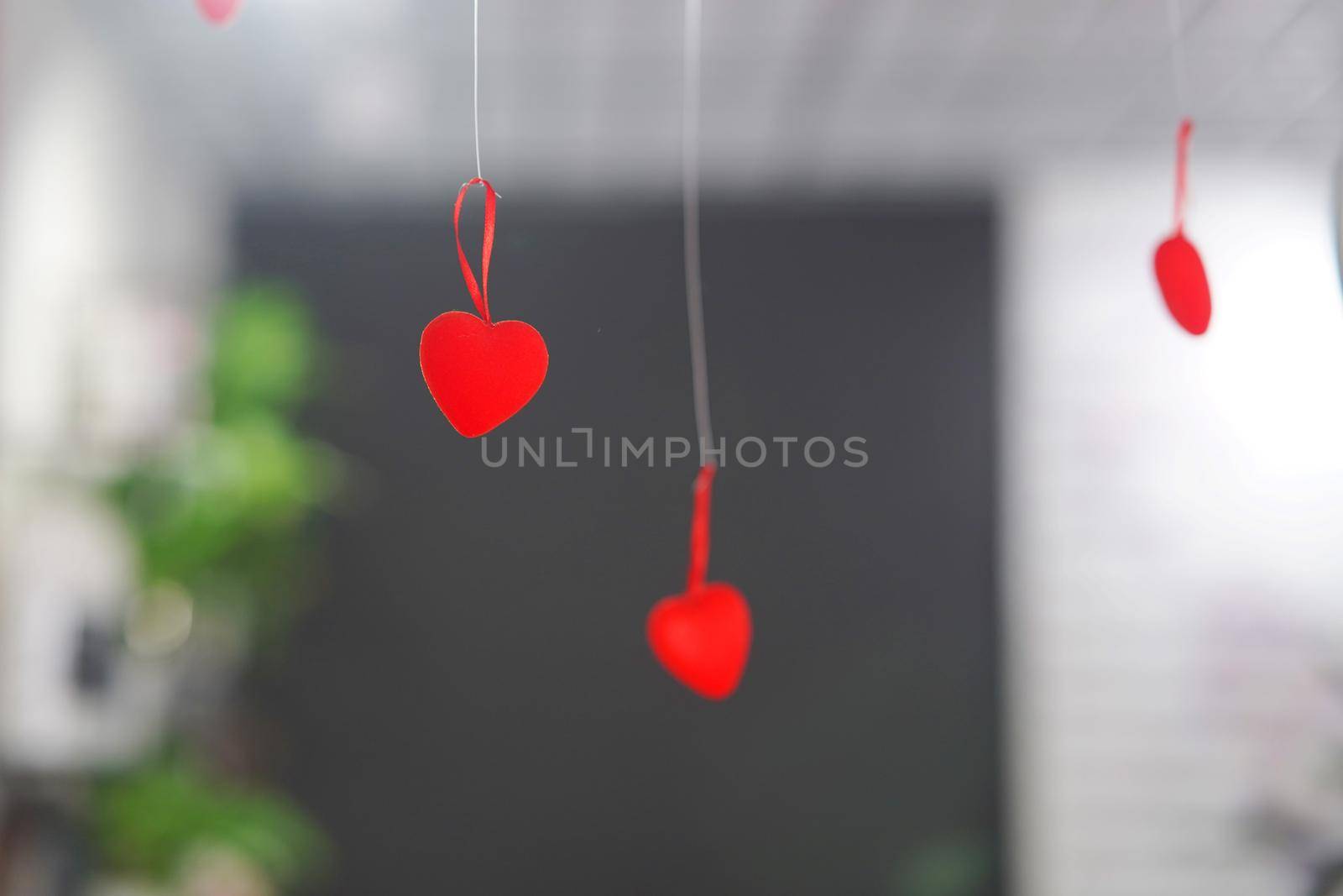 red hearts on strings in the interior. High quality photo
