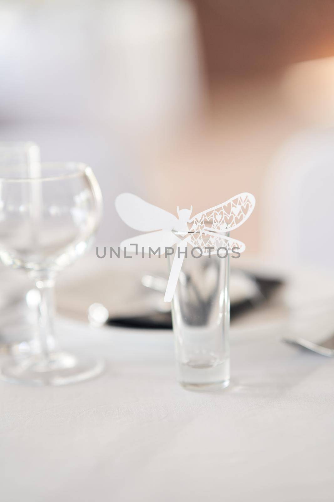 Table set for an event party or wedding reception. Empty wine glasses at a wedding celebration.
