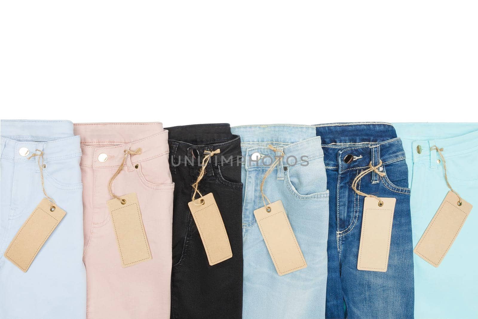 Set of multicolored jeans lined with each other in a row