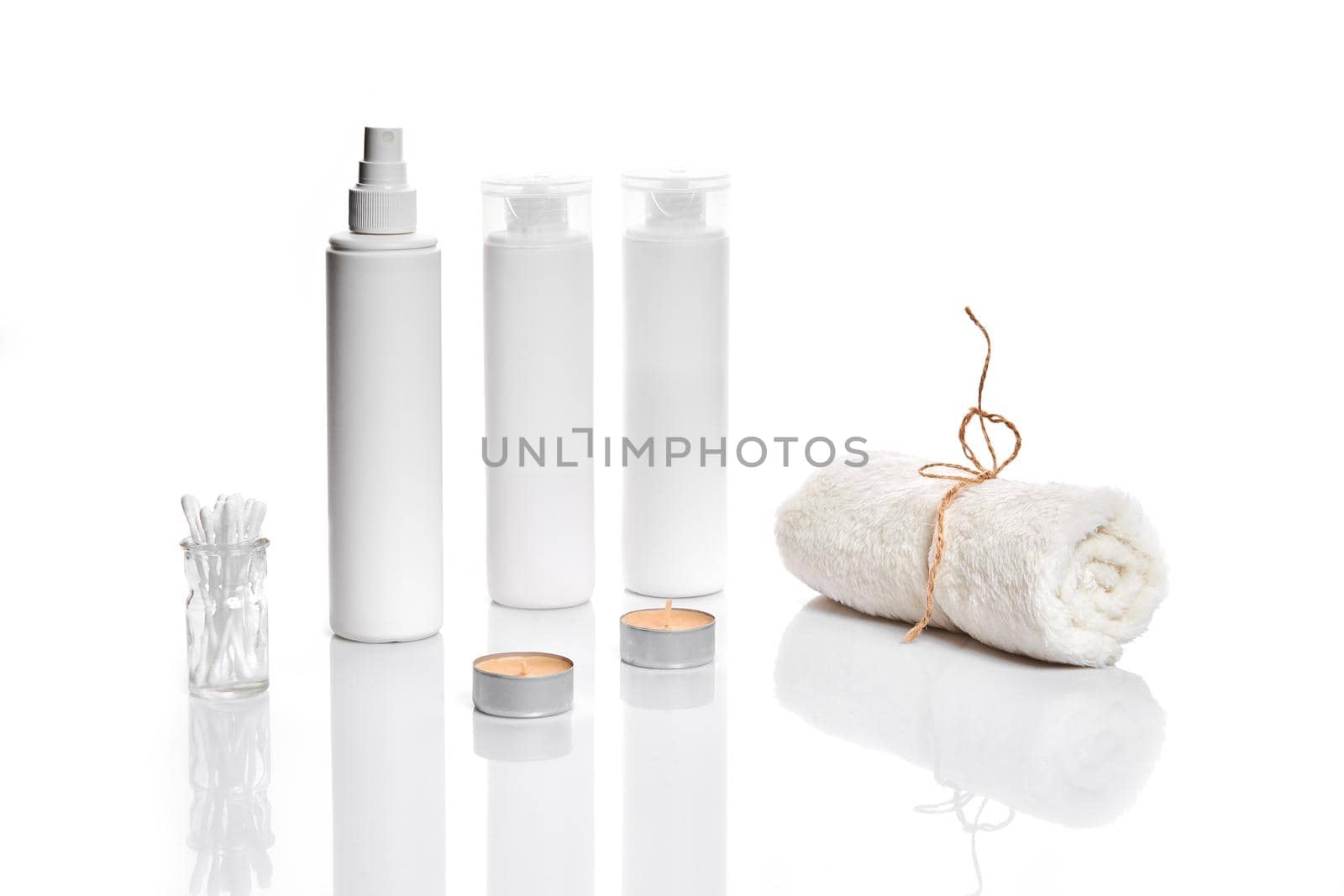Set of cosmetic products in white containers on light background. by nazarovsergey