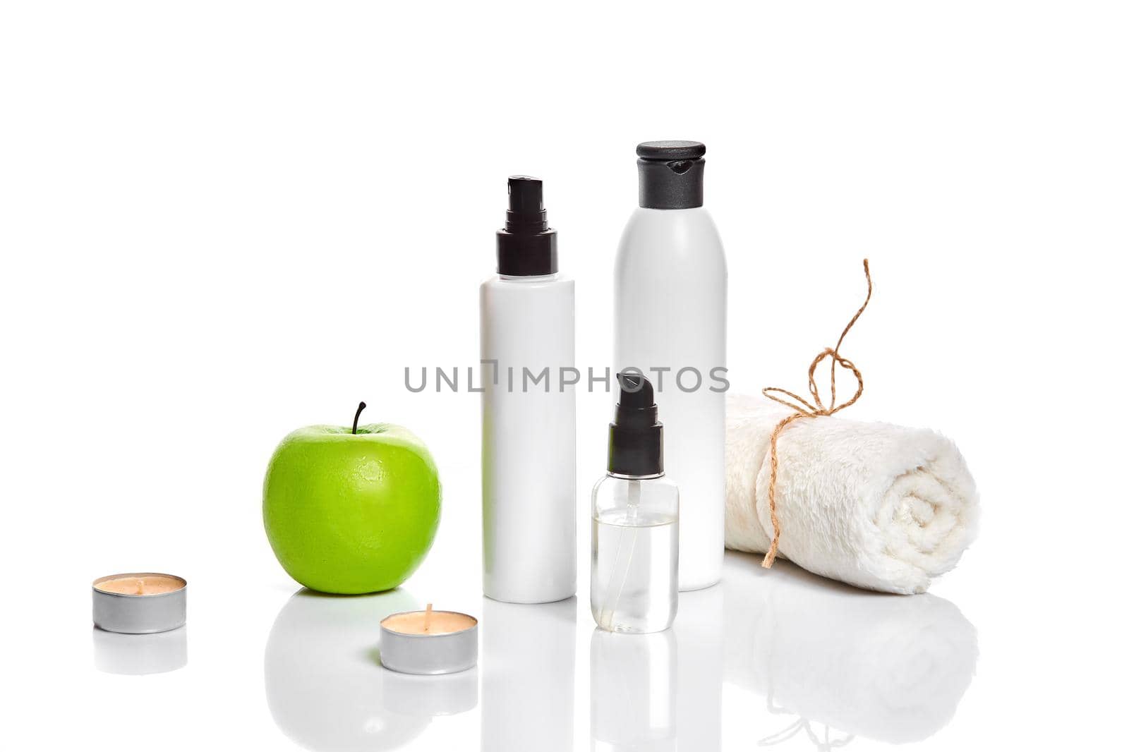 Natural spa beauty treatment cleansing products with apple on white background. by nazarovsergey