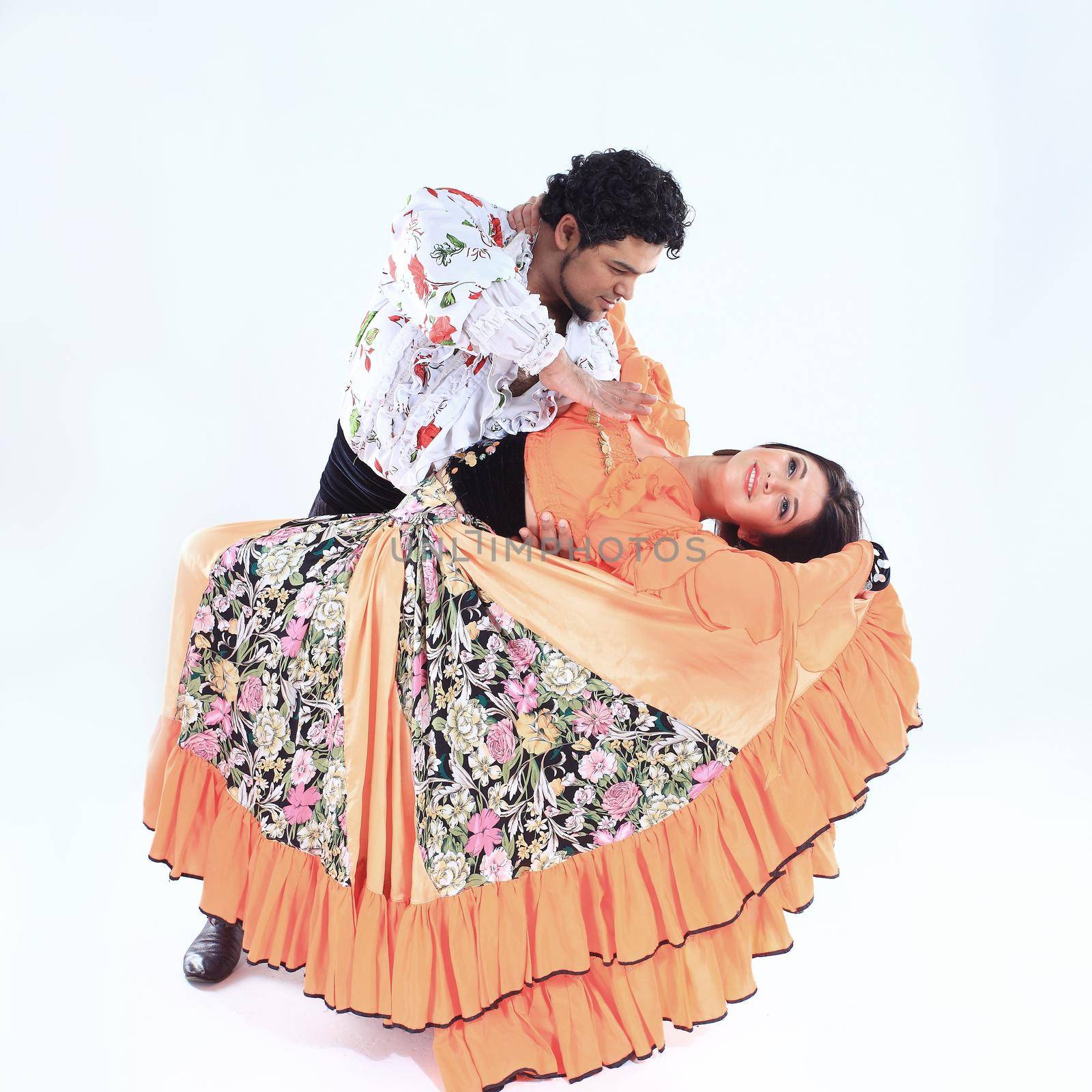 professional dance couple in a Gypsy costume perform folk dance by SmartPhotoLab