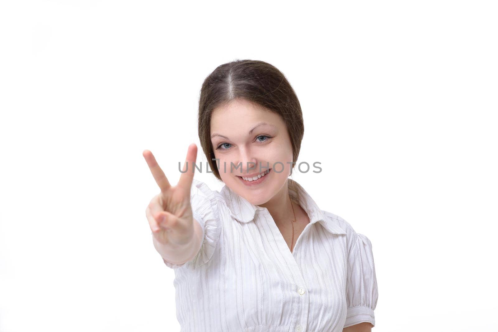 closeup.smiling young woman showing victory sign. by SmartPhotoLab