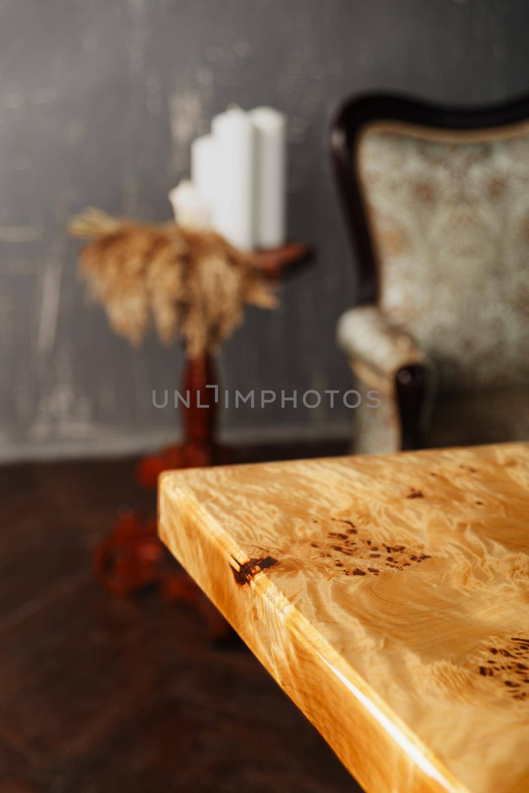 The edge of wooden stylish table made of solid walnut with epoxy resin in stylish interior