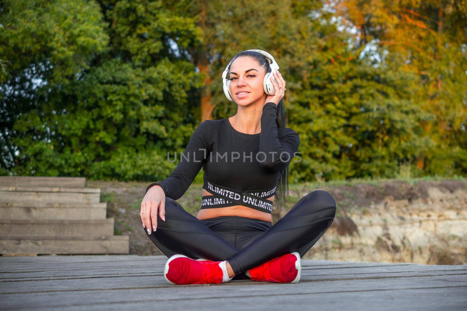 Fitness model with headphones by Proff