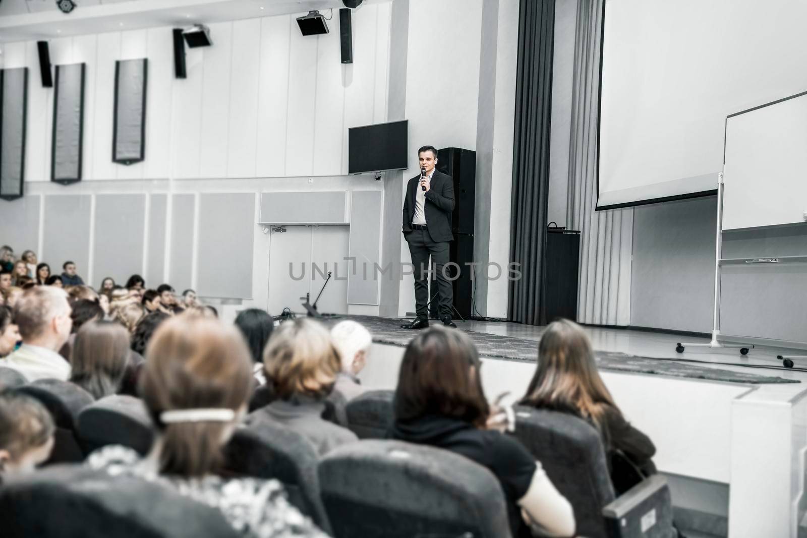 speaker with microphone for business conference. business presentations and business trainings