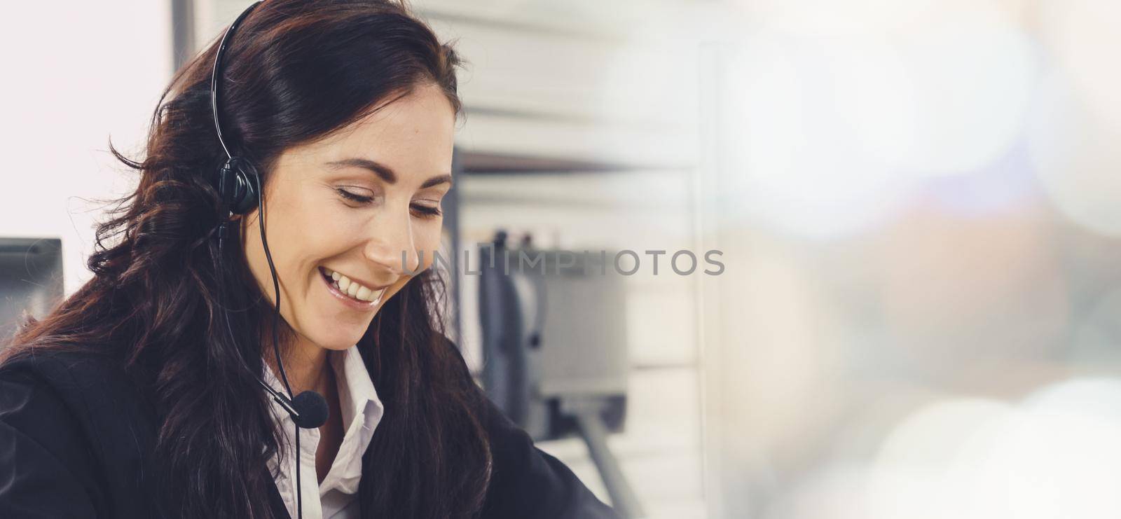 Business people wearing headset working in office broaden view by biancoblue