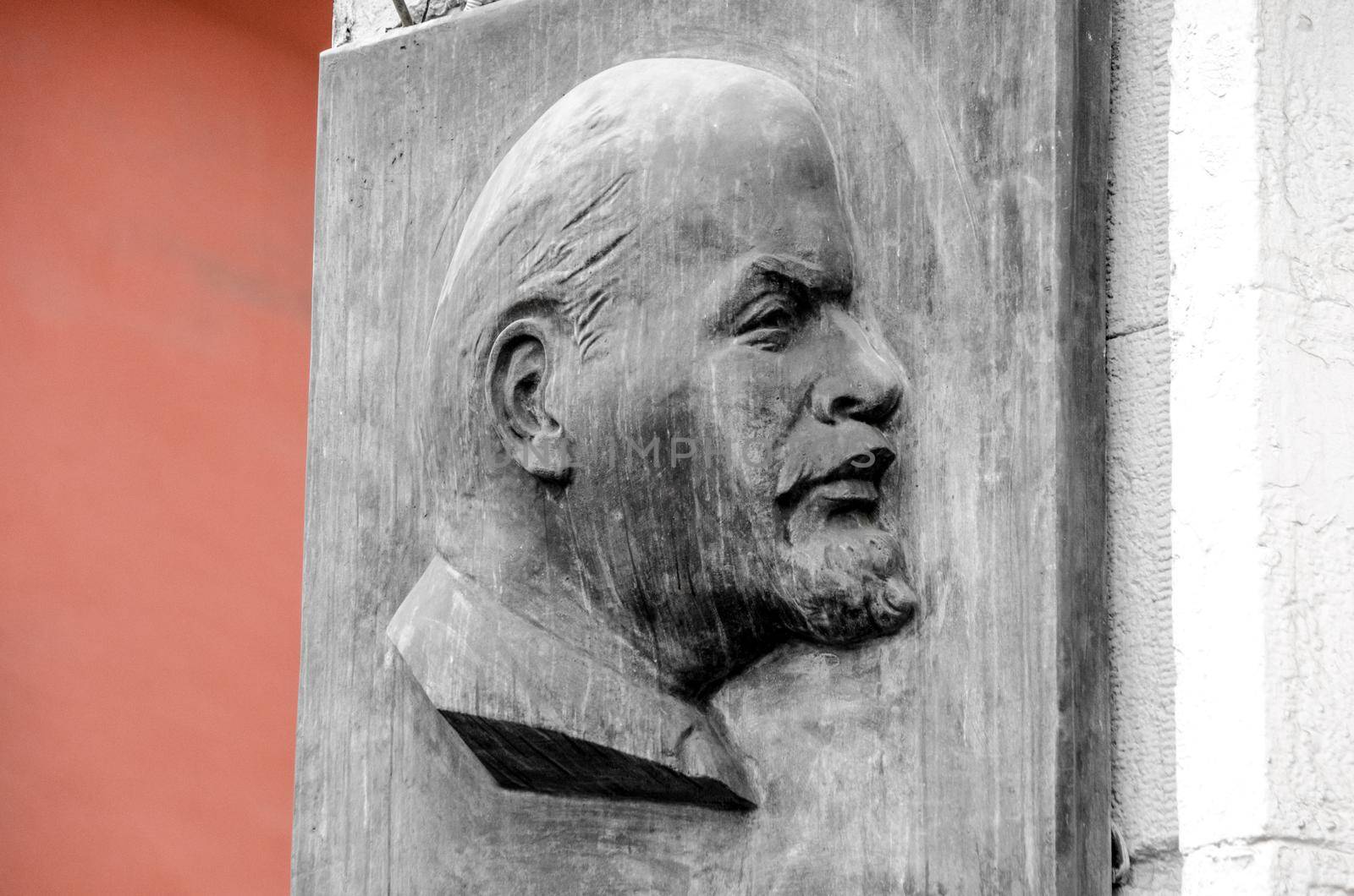 Portrait of Lenin on stone wall