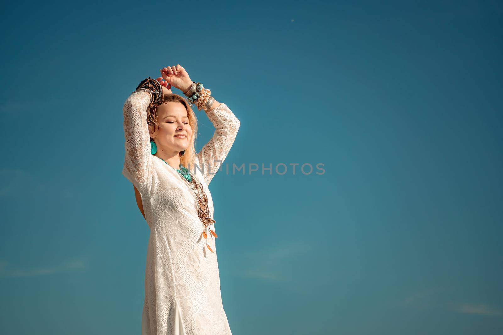 fashionable young model in boho style dress