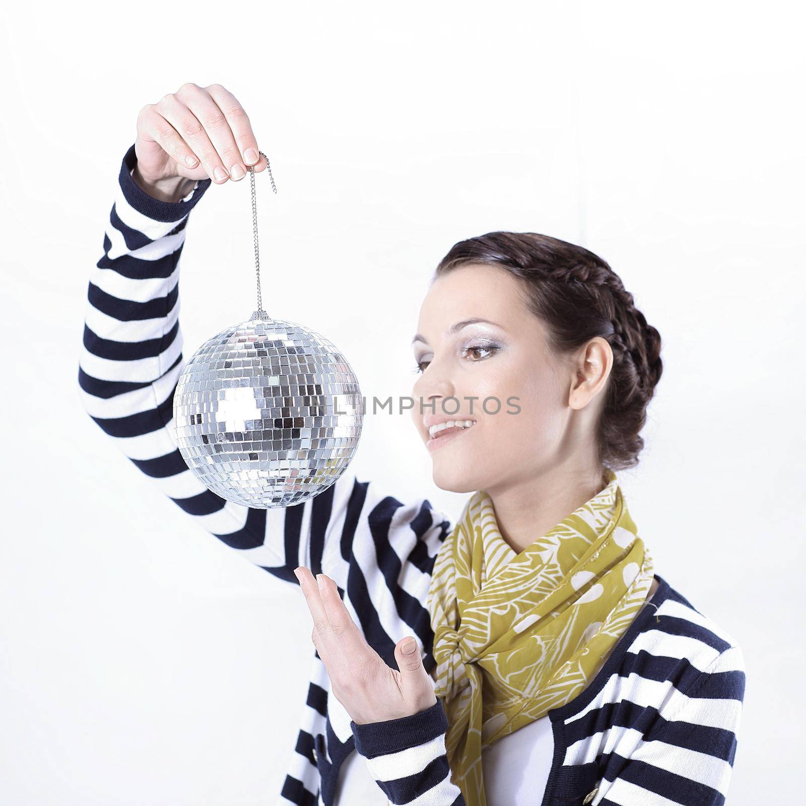 pretty young woman holding a mirror ball.isolated on white background