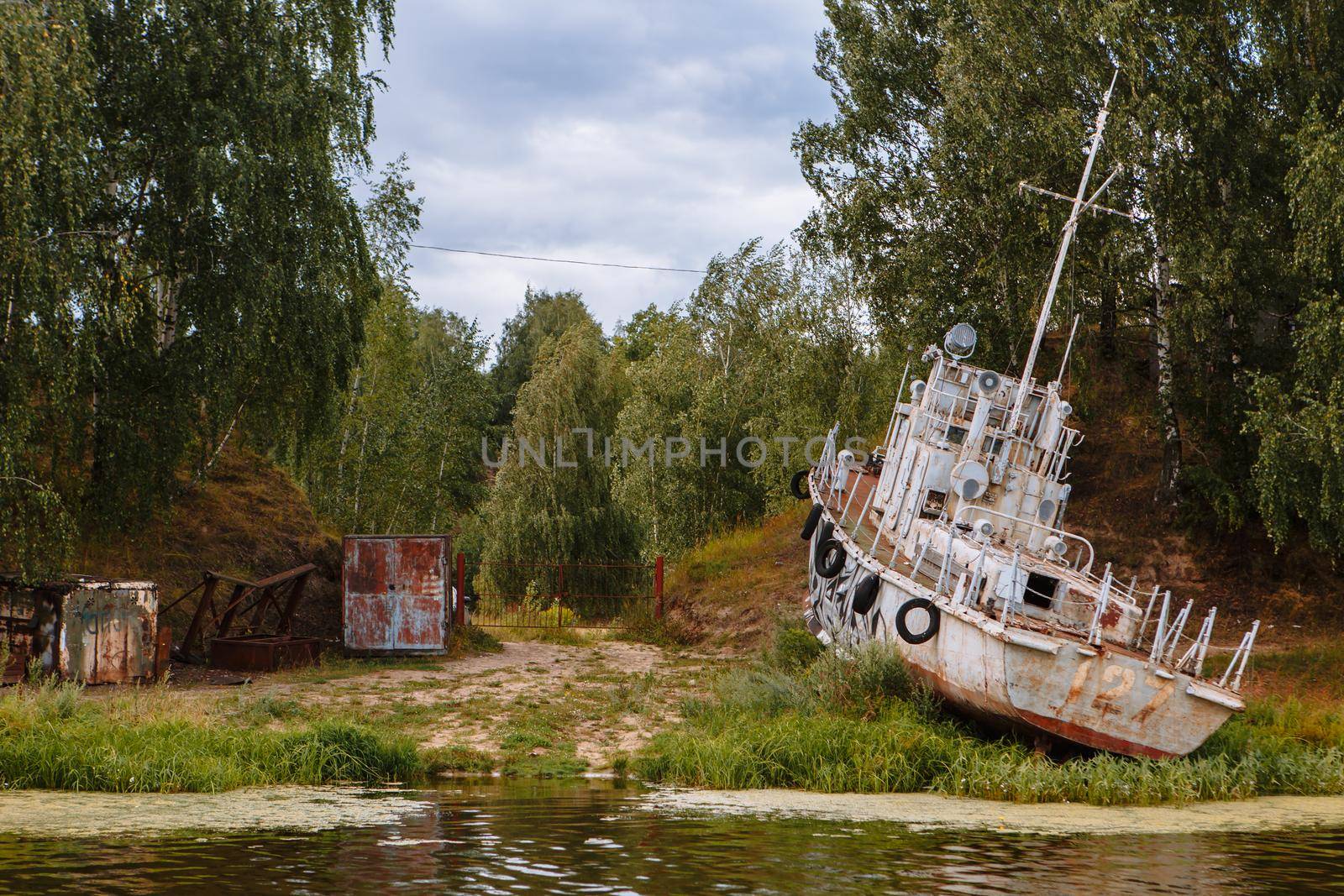 An old rusty military ship, stranded.