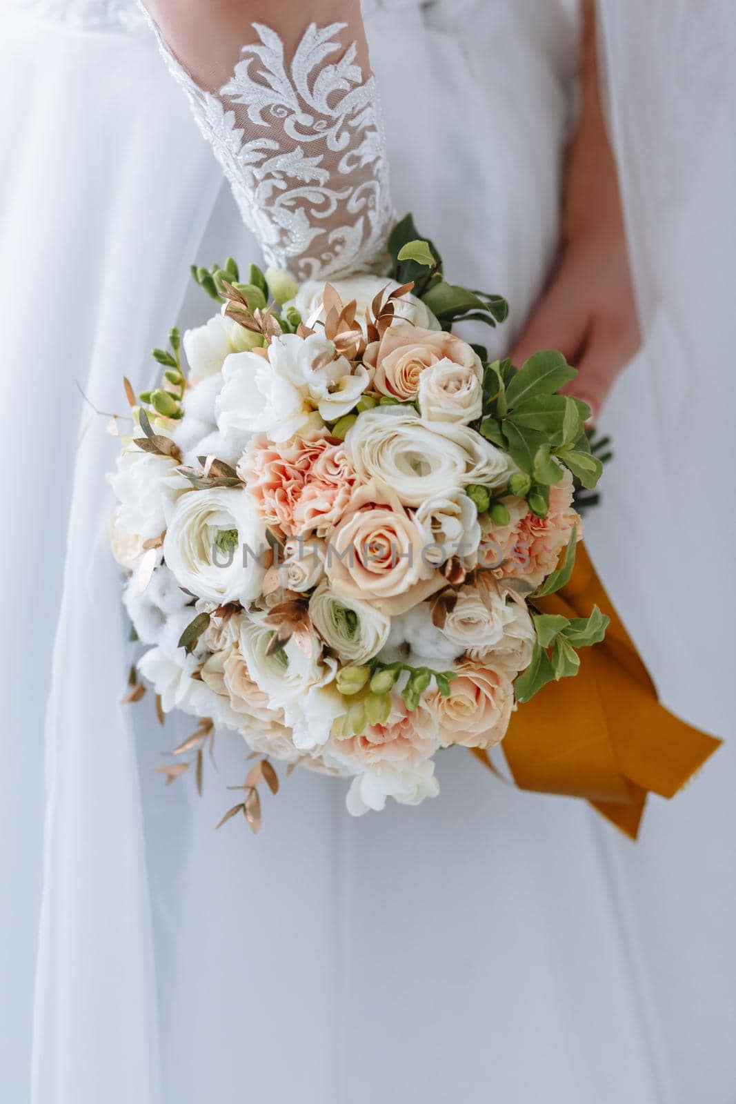 beautiful wedding bouquet in the hands of the bride