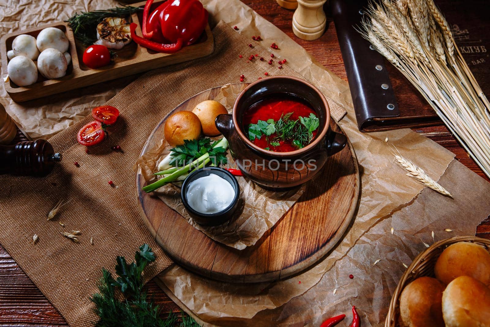 Borscht in a clay pot with sour cream and herbs. by deandy