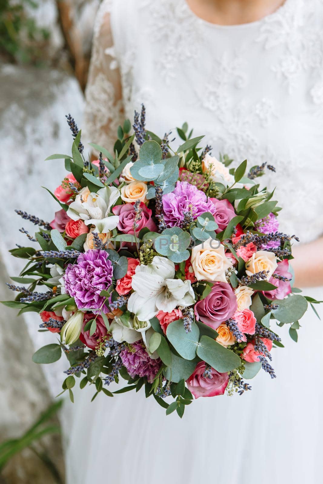 beautiful wedding bouquet in the hands of the bride by deandy