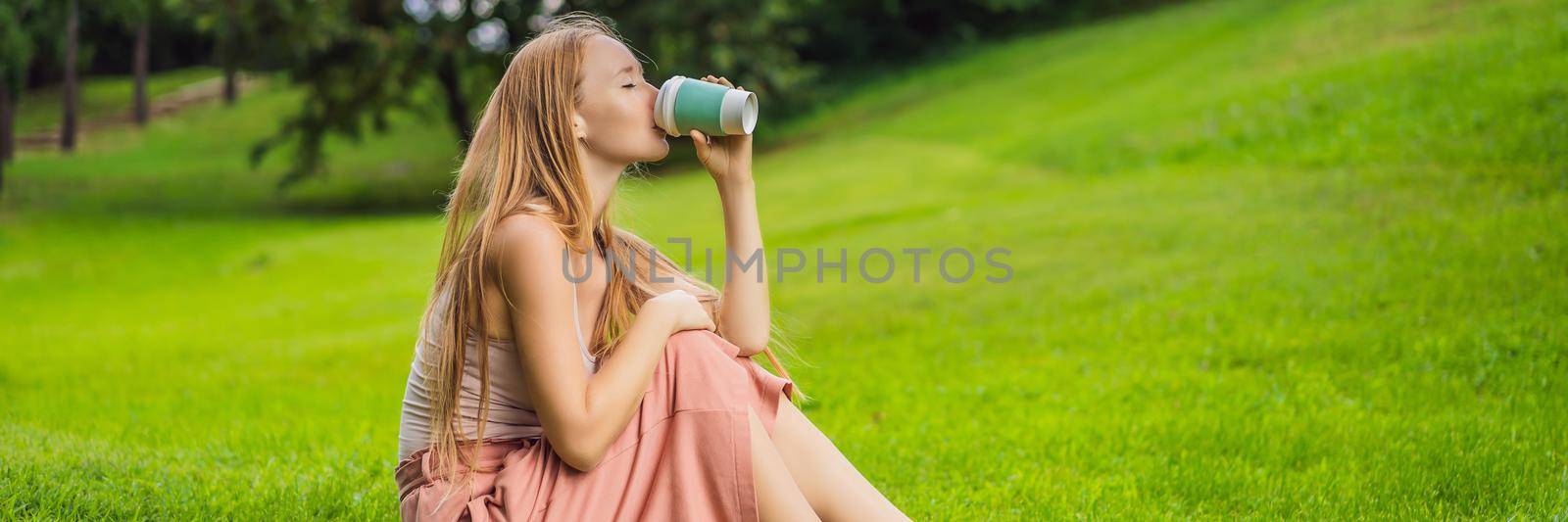 Dreamy young woman having a cup of coffee outside. BANNER, LONG FORMAT
