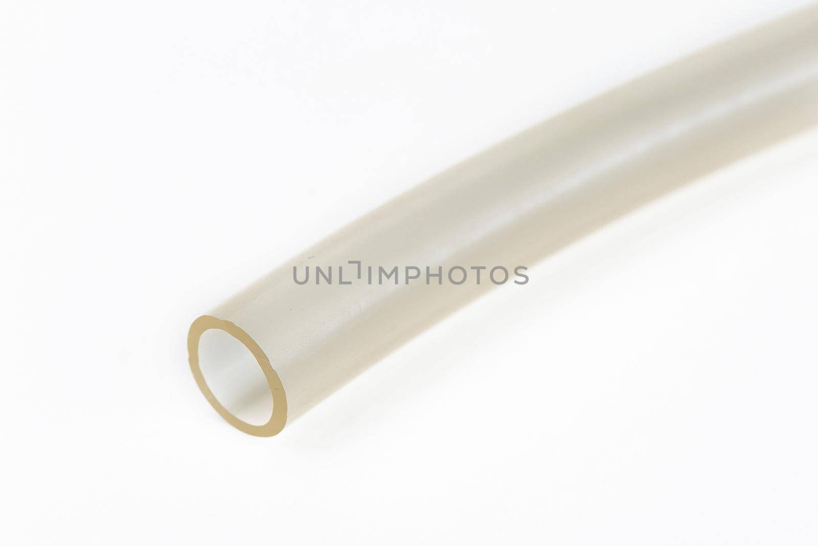 The cut tip of the rubber hose, on a white background by deandy
