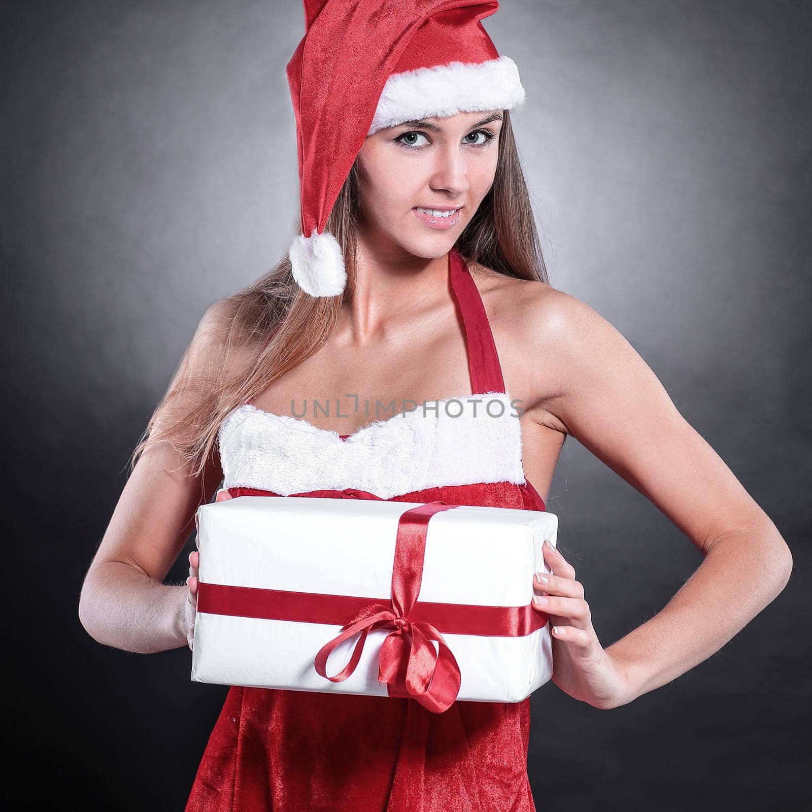beautiful woman in costume of Santa Claus with Christmas shoppin by SmartPhotoLab