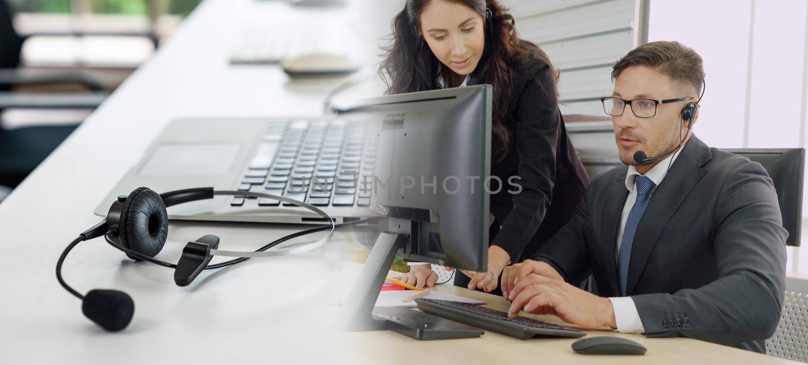 Business people wearing headset working in office broaden view by biancoblue