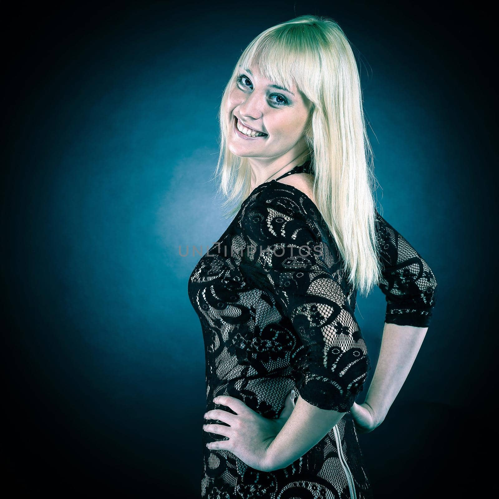 portrait of beautiful young woman in evening black dress. isolated on black.photo with copy space.