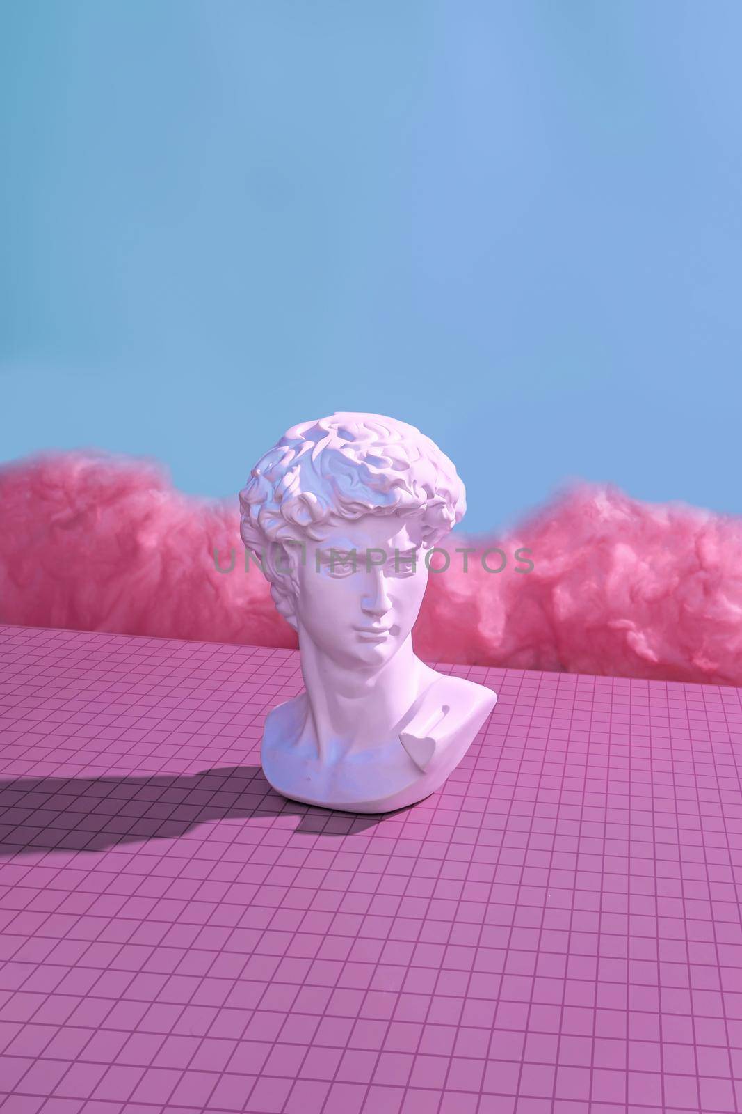 Michelangelo's David in the virtual cyberpunk metaverse. Minimal concept of future and digital innovation in pastel color trend color.