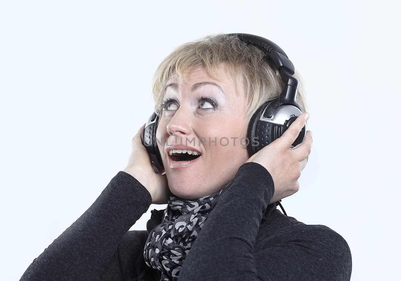 beautiful woman listening to music with headphones.isolated on a white background.