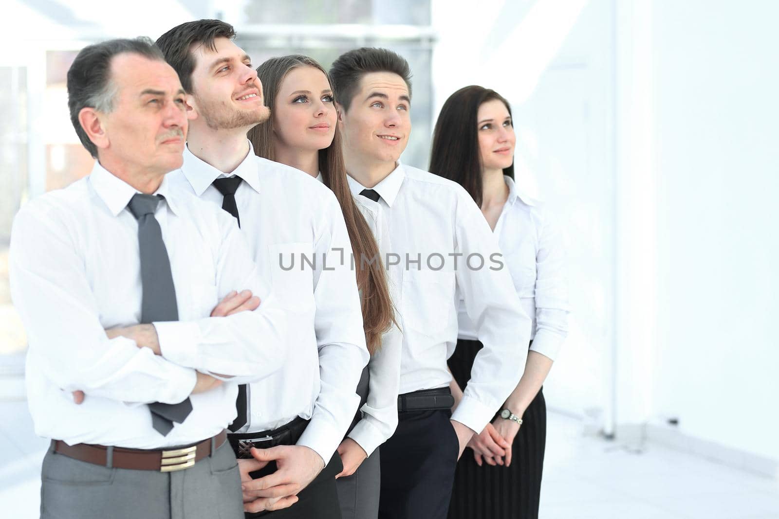 successful business team looking at copy space.business background