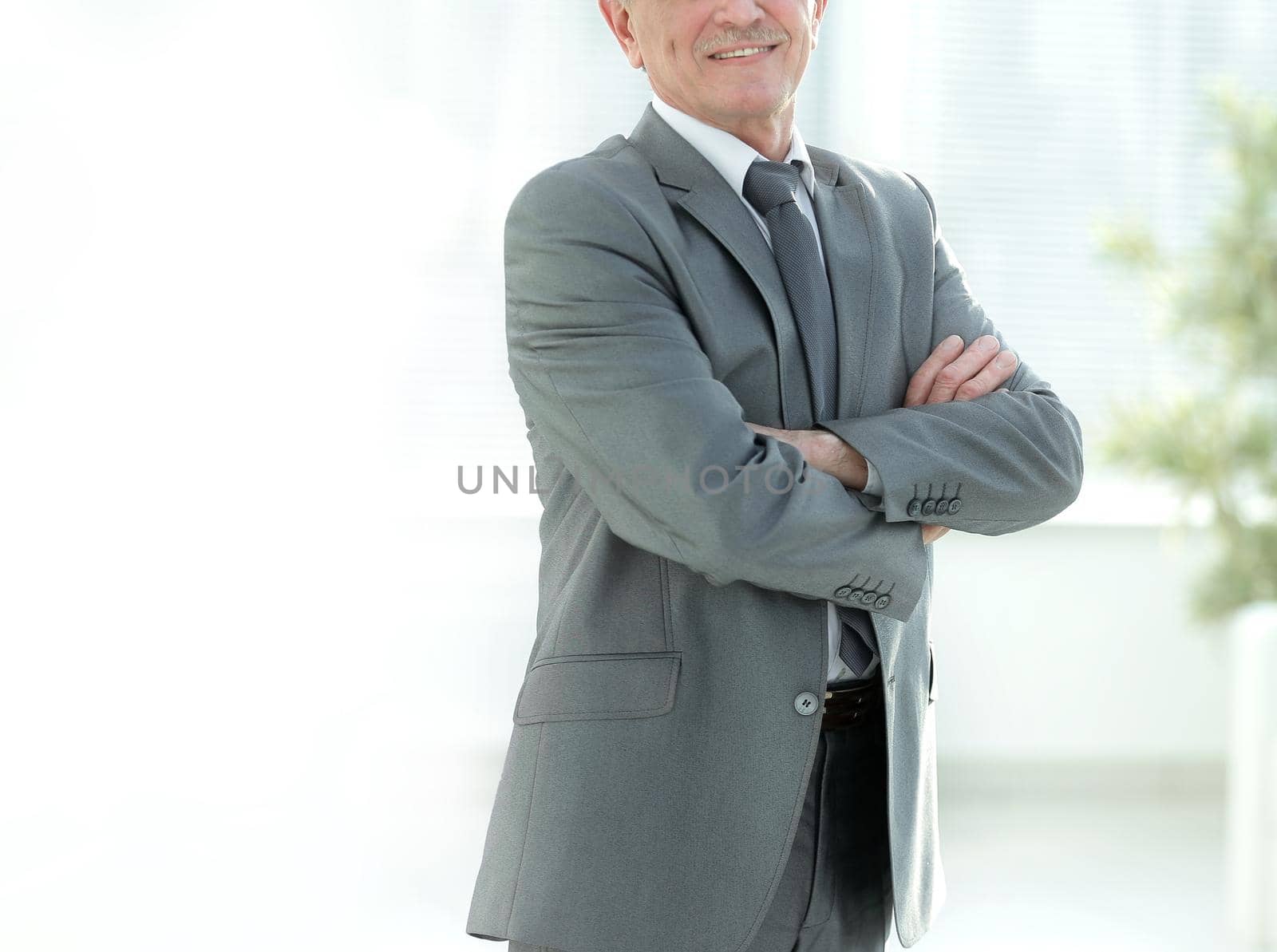 portrait of a successful Mature businessman in modern office photo with copy space