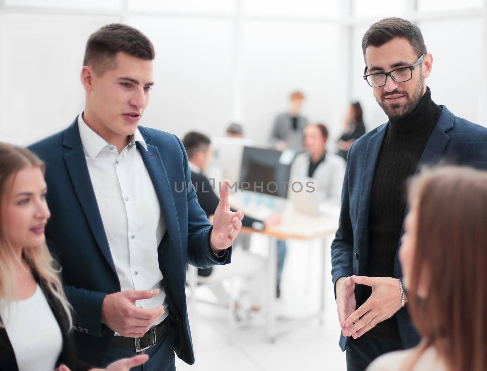 business people discuss something standing in the office. business concept