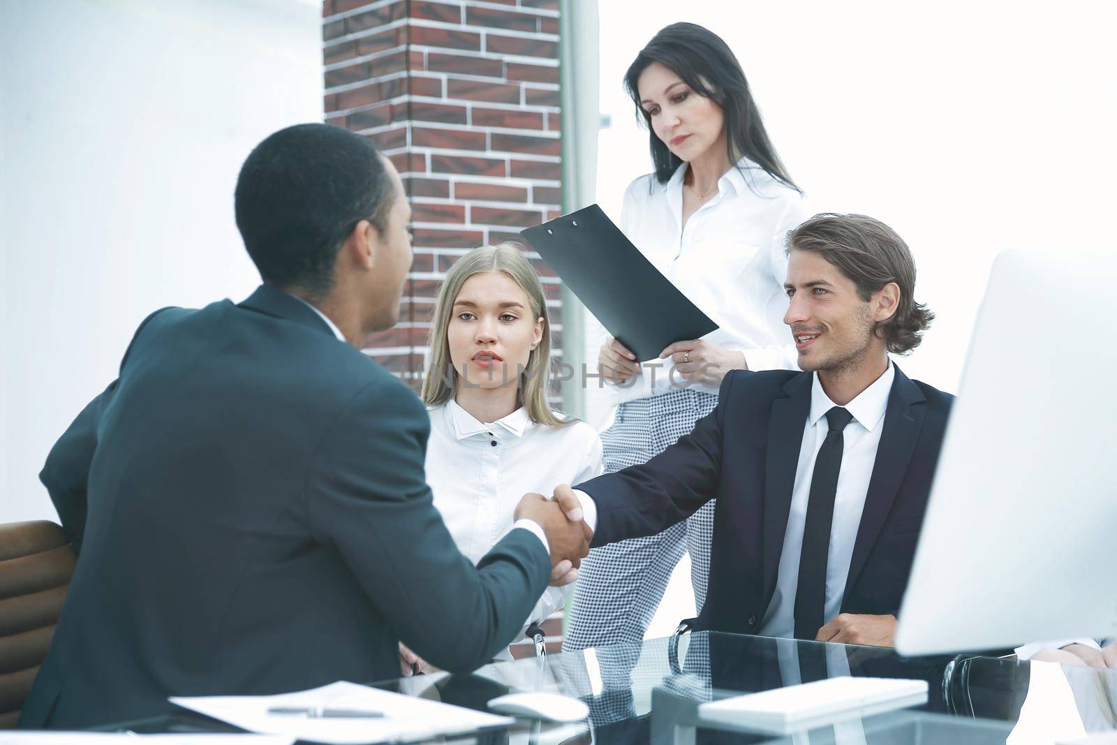 Business Partner Shake Hands on meetinig in modern office building.business concept
