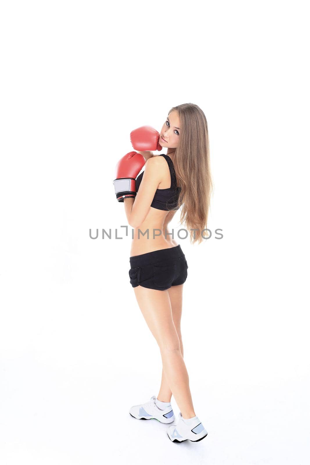 portrait of young fitness woman in red Boxing gloves by SmartPhotoLab