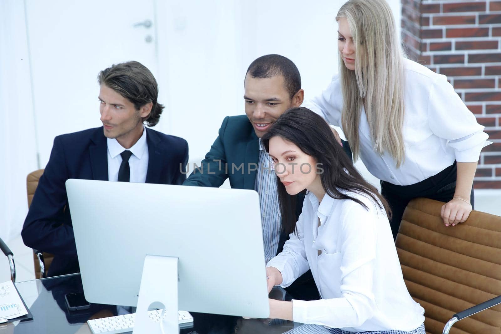 business people discussing financial information,sitting at his Desk by SmartPhotoLab