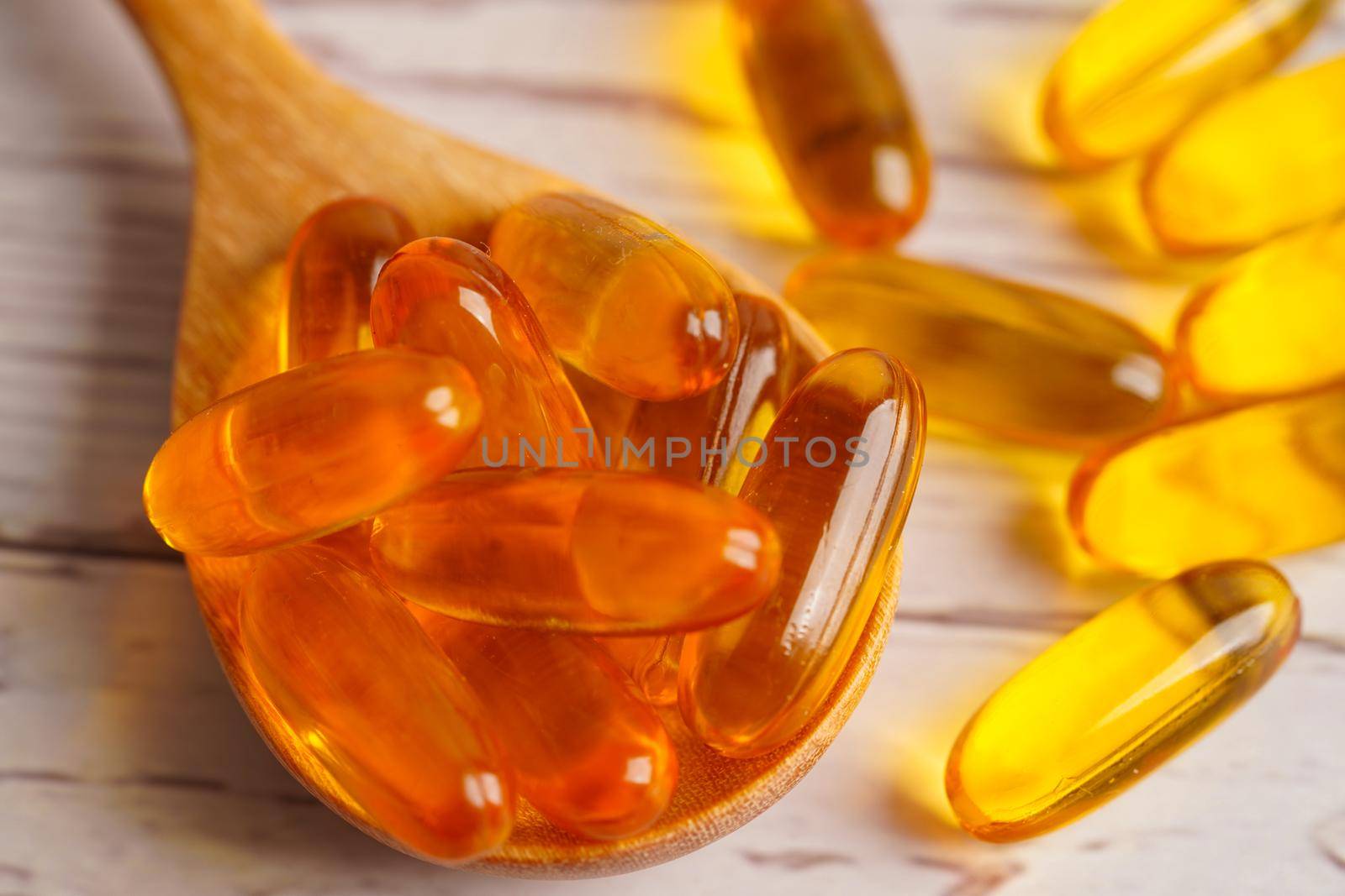Fish oil or Cod liver oil gel in capsules with omega 3 vitamins, supplementary healthy food 