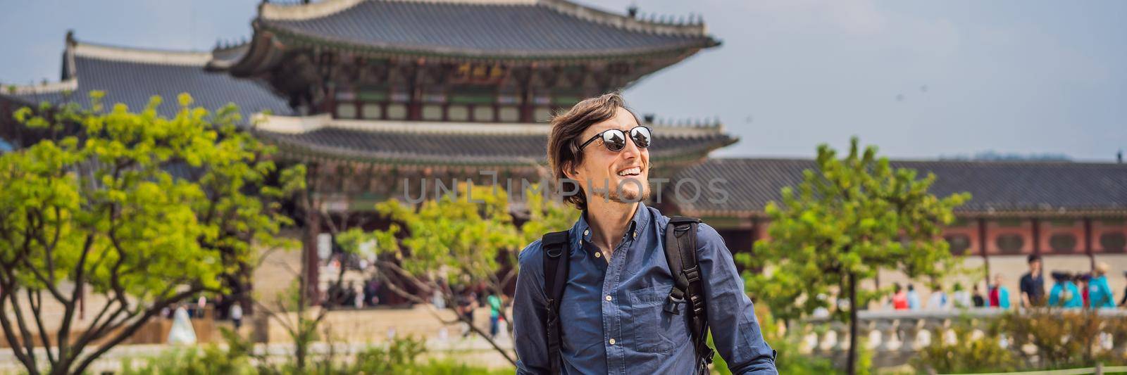 Man tourist in Seoul, South Korea. Travel to Korea concept. BANNER, LONG FORMAT