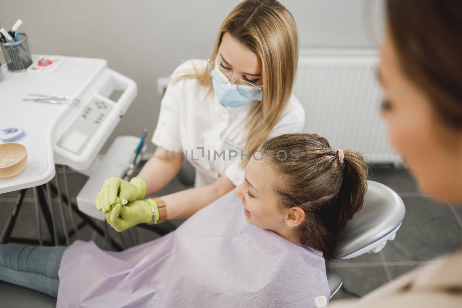 Shot of a teenager girl having a consultation with her dentist.