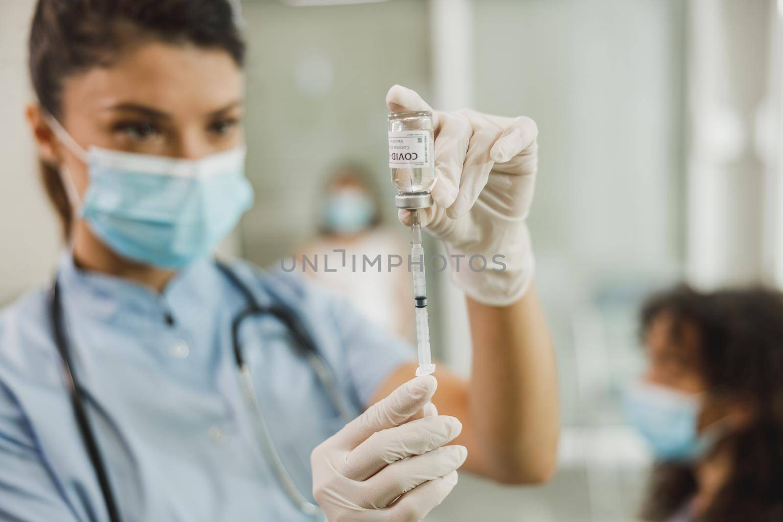 Nurse Preparing Vaccine Dose To Vaccination Against Coronavirus by MilanMarkovic78