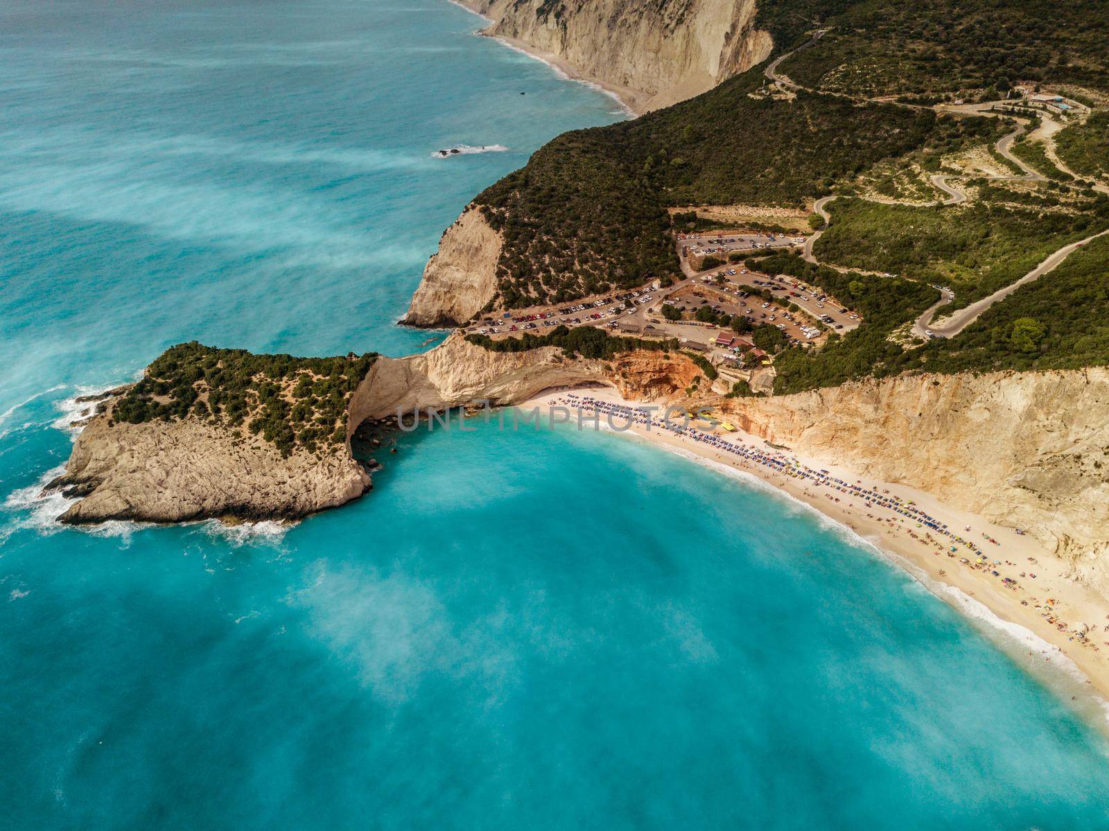 Aerial view from drone of amazing nature background. Azure beach with rocky mountains and clear water of Mediterranean sea at sunny day.