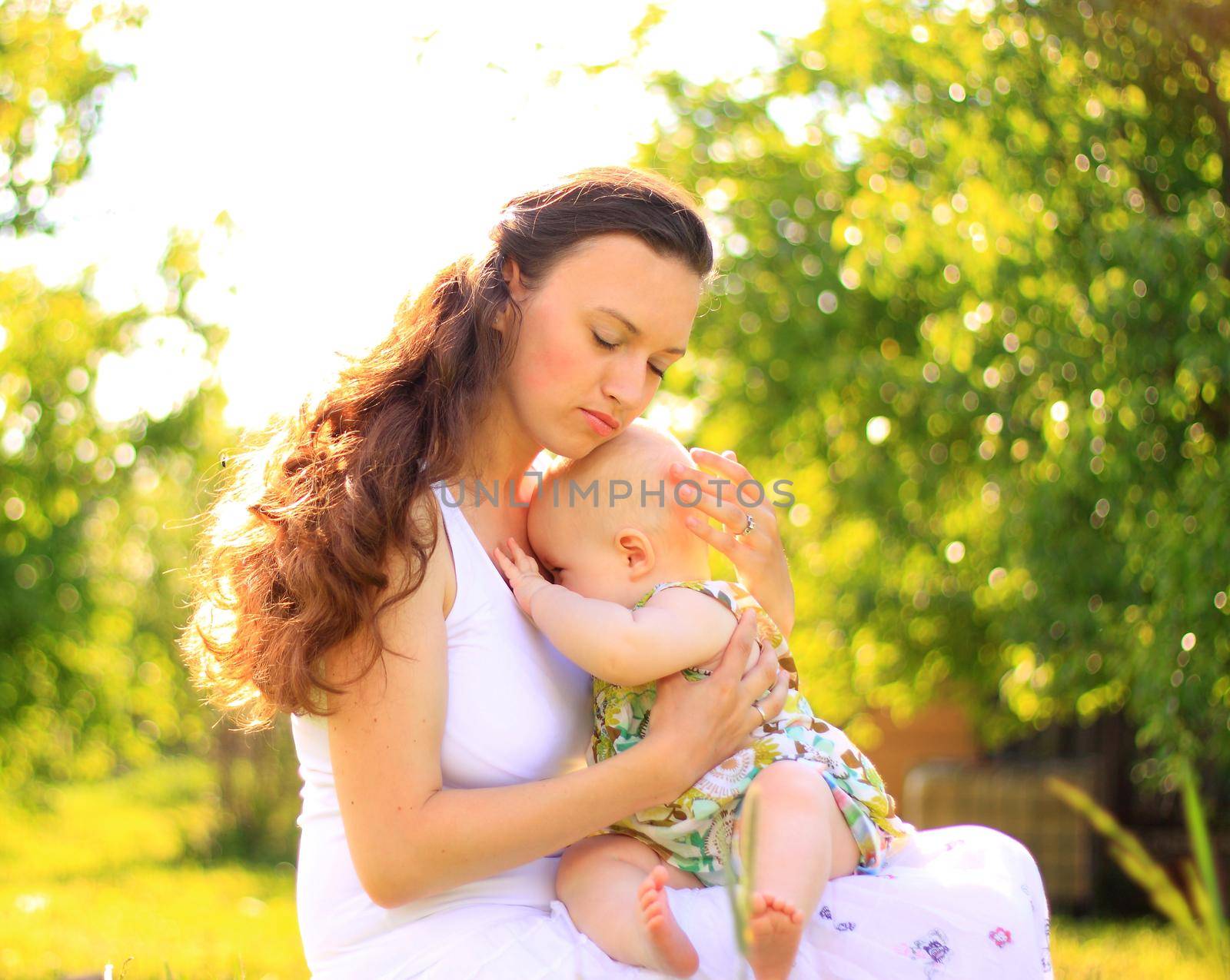 Beautiful Mother And Baby outdoors. Nature. Beauty Mum and her Child playing in Park together by SmartPhotoLab