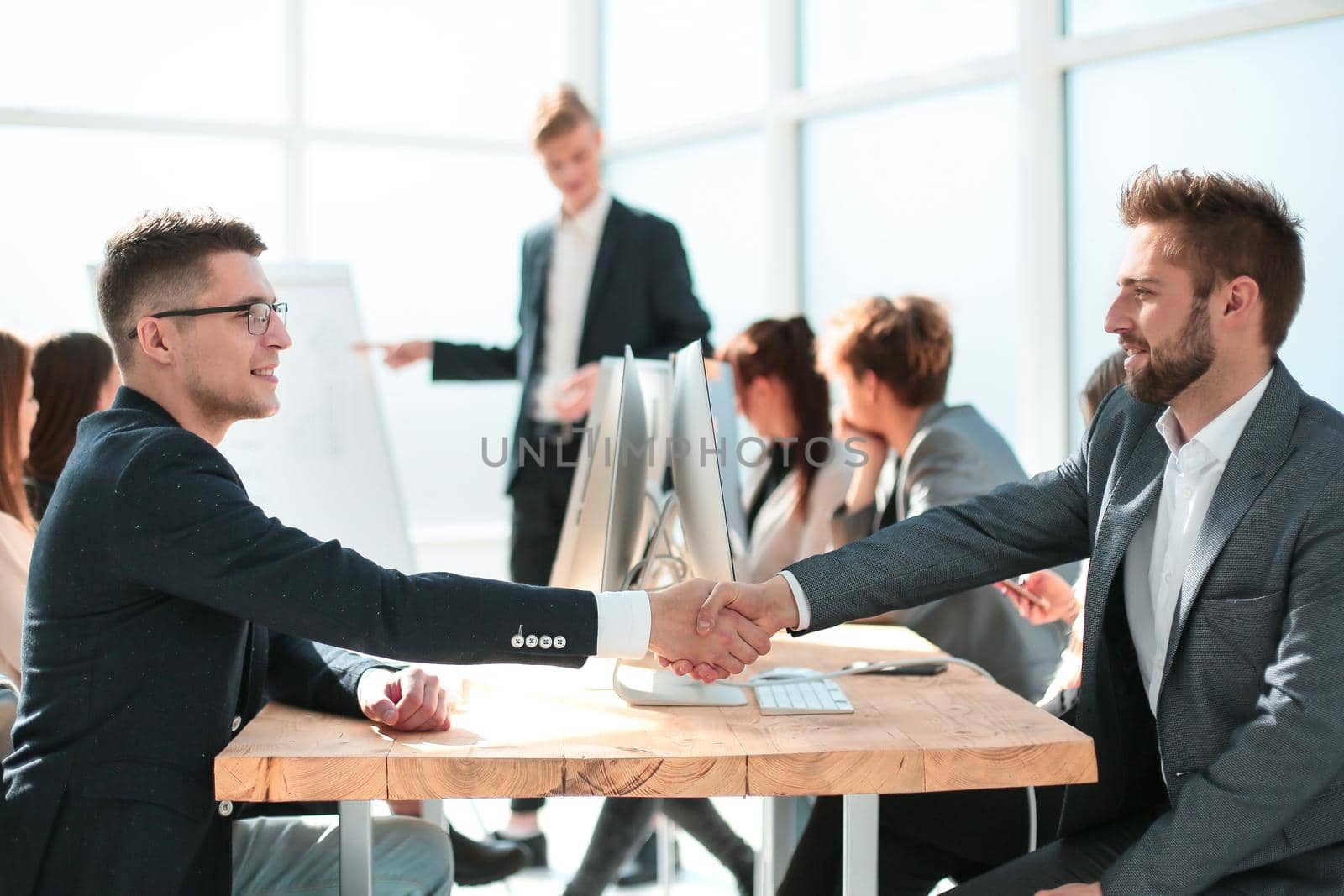 business partners shaking hands during a business presentation. concept of cooperation