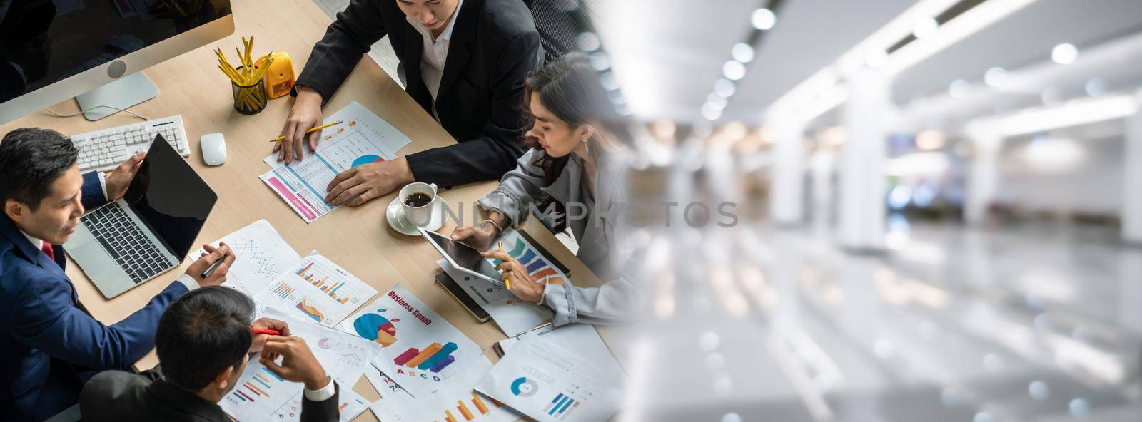 Business people group meeting shot from top widen view in office . Profession businesswomen, businessmen and office workers working in team conference with project planning document on meeting table .