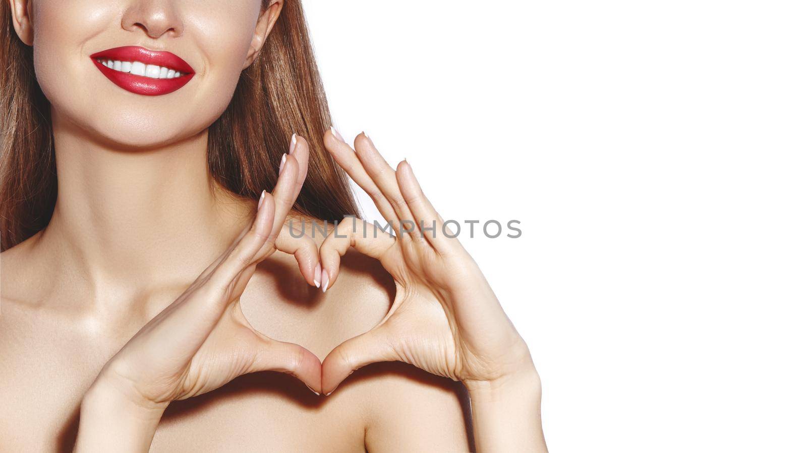 Romantic young Woman making Heart Shape with her Fingers. Love and Valentines Day Symbol. Fashion girl with Happy Smile by MarinaFrost