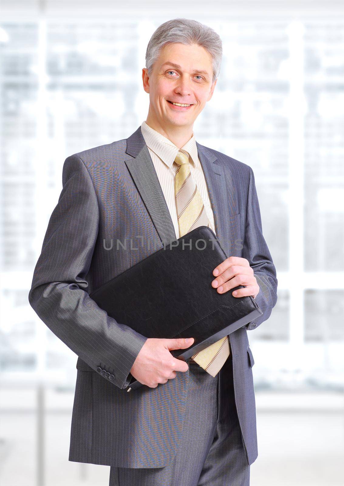 Businessman with the documents in the office.