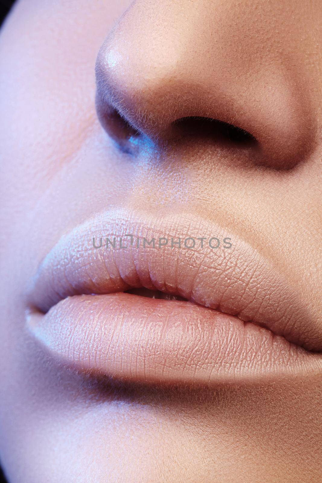 Moisturizing lip balm, lipstick. Close-up of a beautiful sexy lips. Nice full lips with lip makeup. Filler Injections, Plastic Surgery, Collagen and Treatments