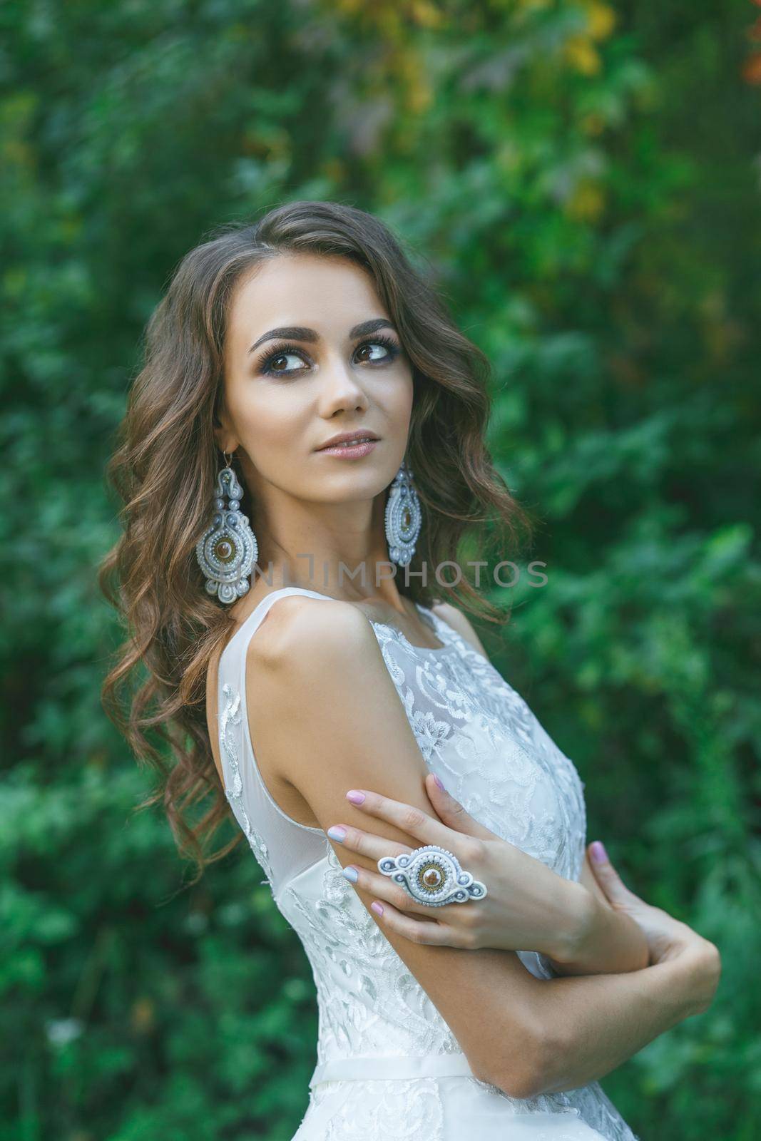 Beautiful young bride with long curly hair by BY-_-BY