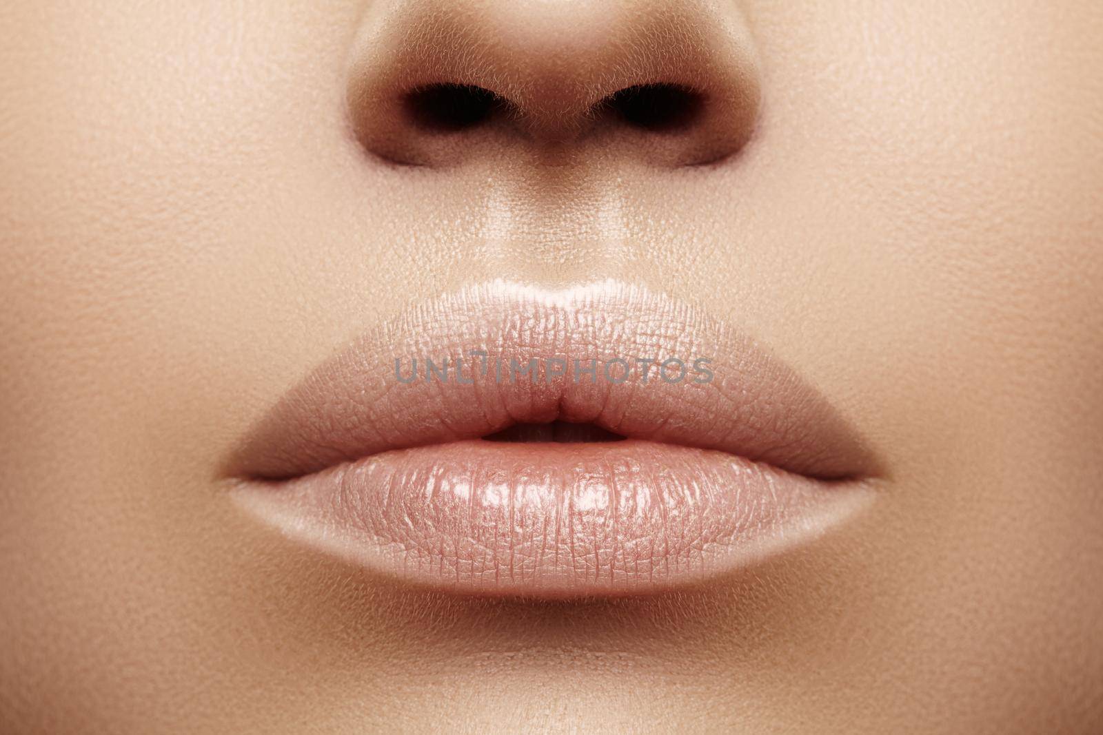 Closeup plump Lips. Lip Care, Augmentation, Fillers. Macro photo with Face detail. Natural shape with perfect contour. Close-up perfect natural lip makeup beautiful female mouth. Plump sexy full lips