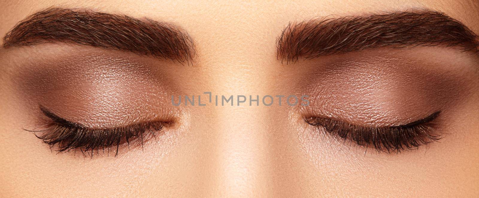 Perfect shape of eyebrows and extremly long eyelashes. Macro shot of fashion eyes visage. Before and after by MarinaFrost