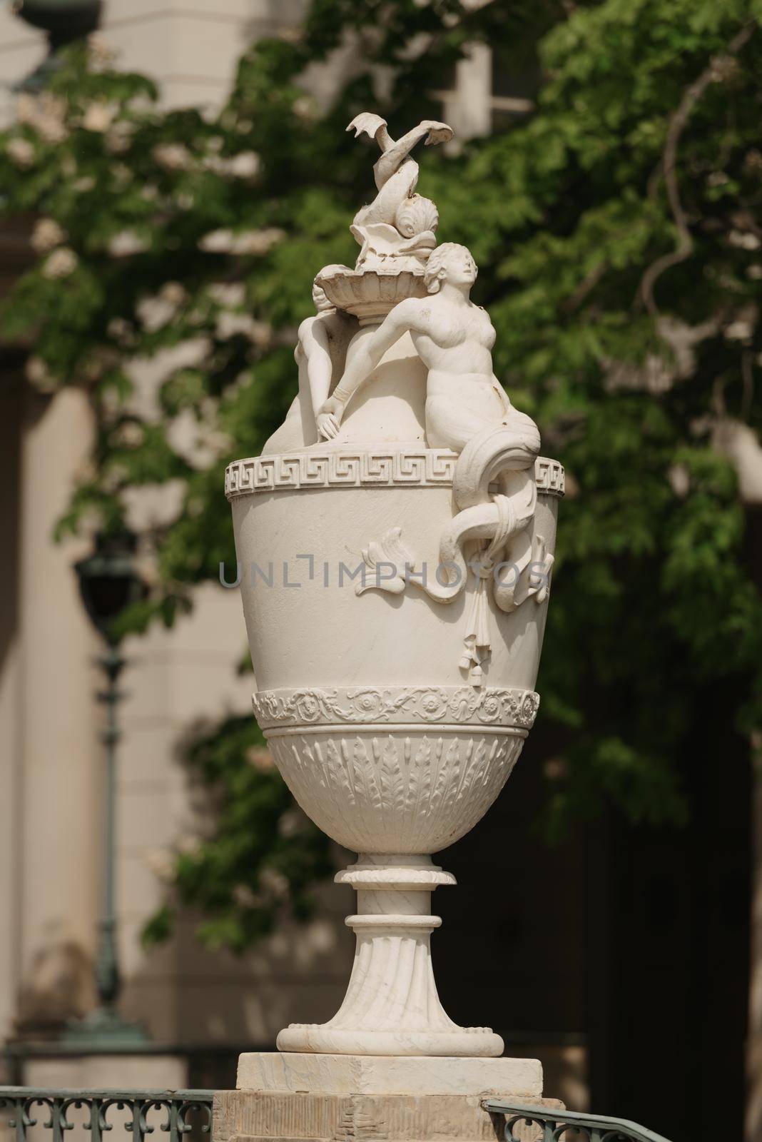 Warsaw, Poland - MAY 12, 2022: The old outdoor vase with sculptures in Royal Baths Park, Lazienki Park