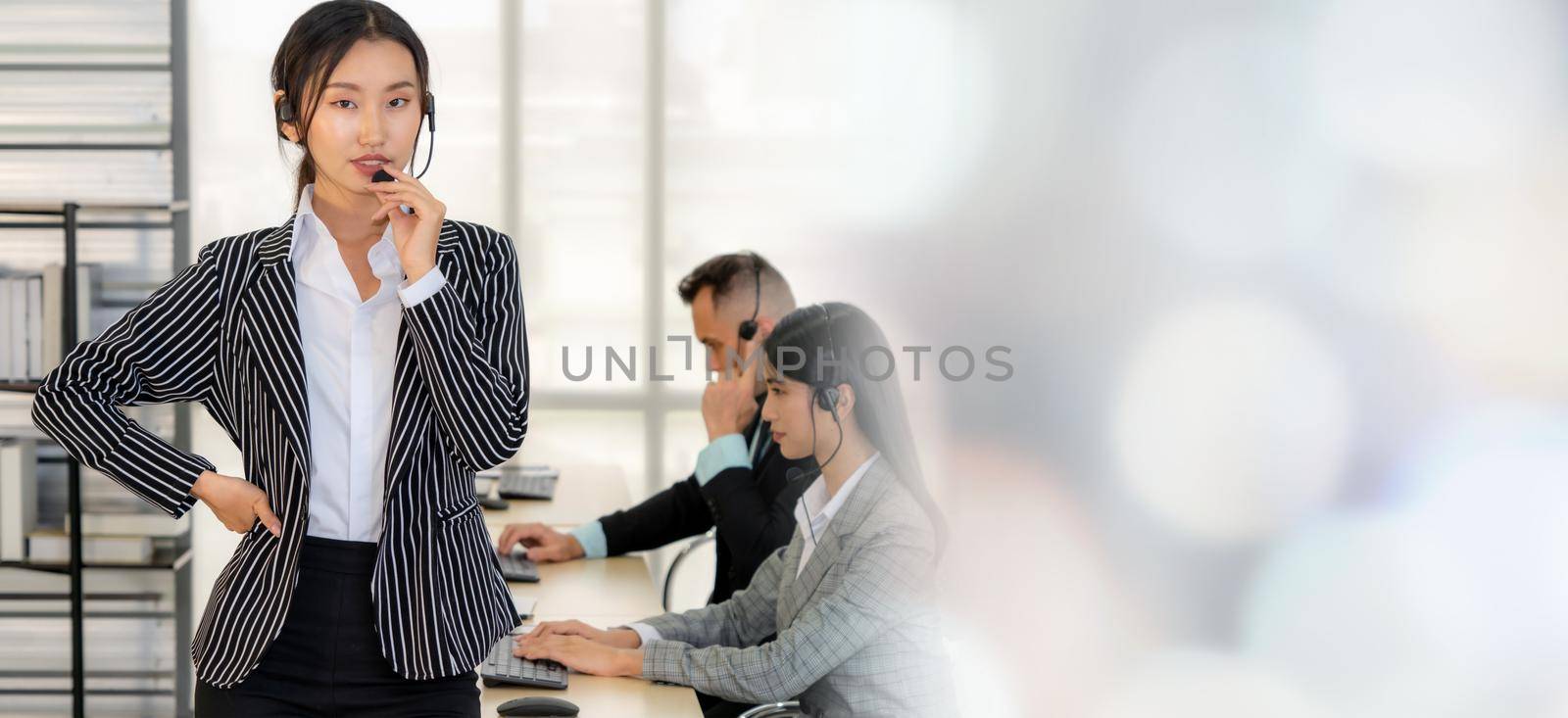 Business people wearing headset working in office broaden view by biancoblue