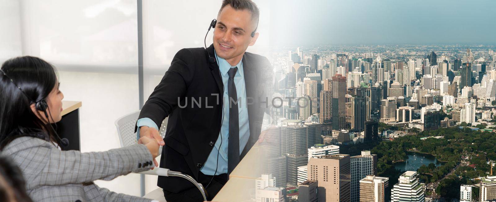 Business people wearing headset celebrate working in office . Call center, telemarketing, customer support agent provide service on telephone video conference call. broaden view